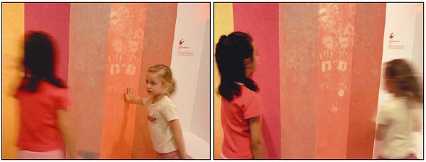 Figs : 2a, 2b. “Touch Me Wallpaper” at the exhibition “Touch Me,” Victoria & Albert Museum, London, 2005. Visitors interacting with the responsive textile wall. Photo © Zane Berzina.